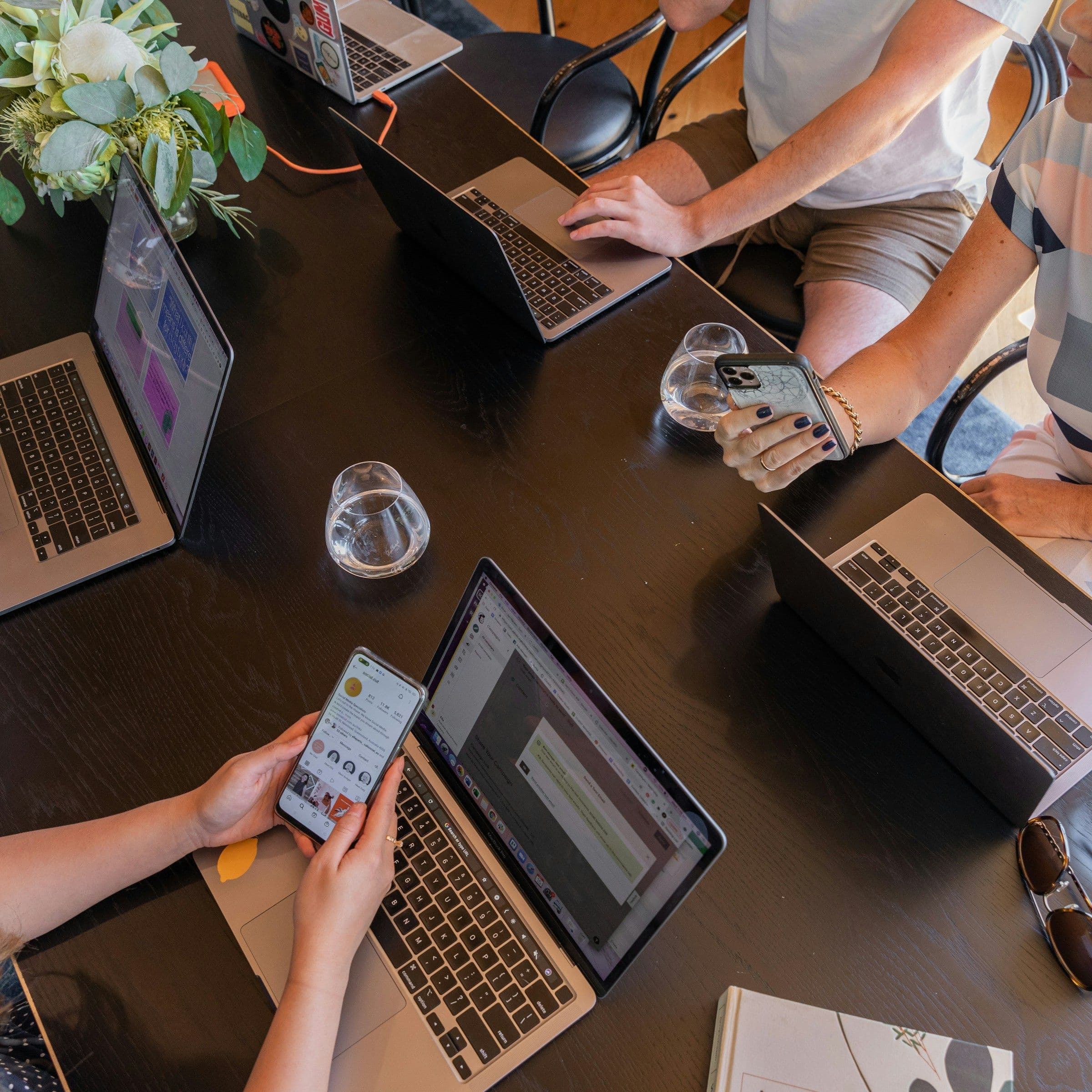 People working on laptops during a session