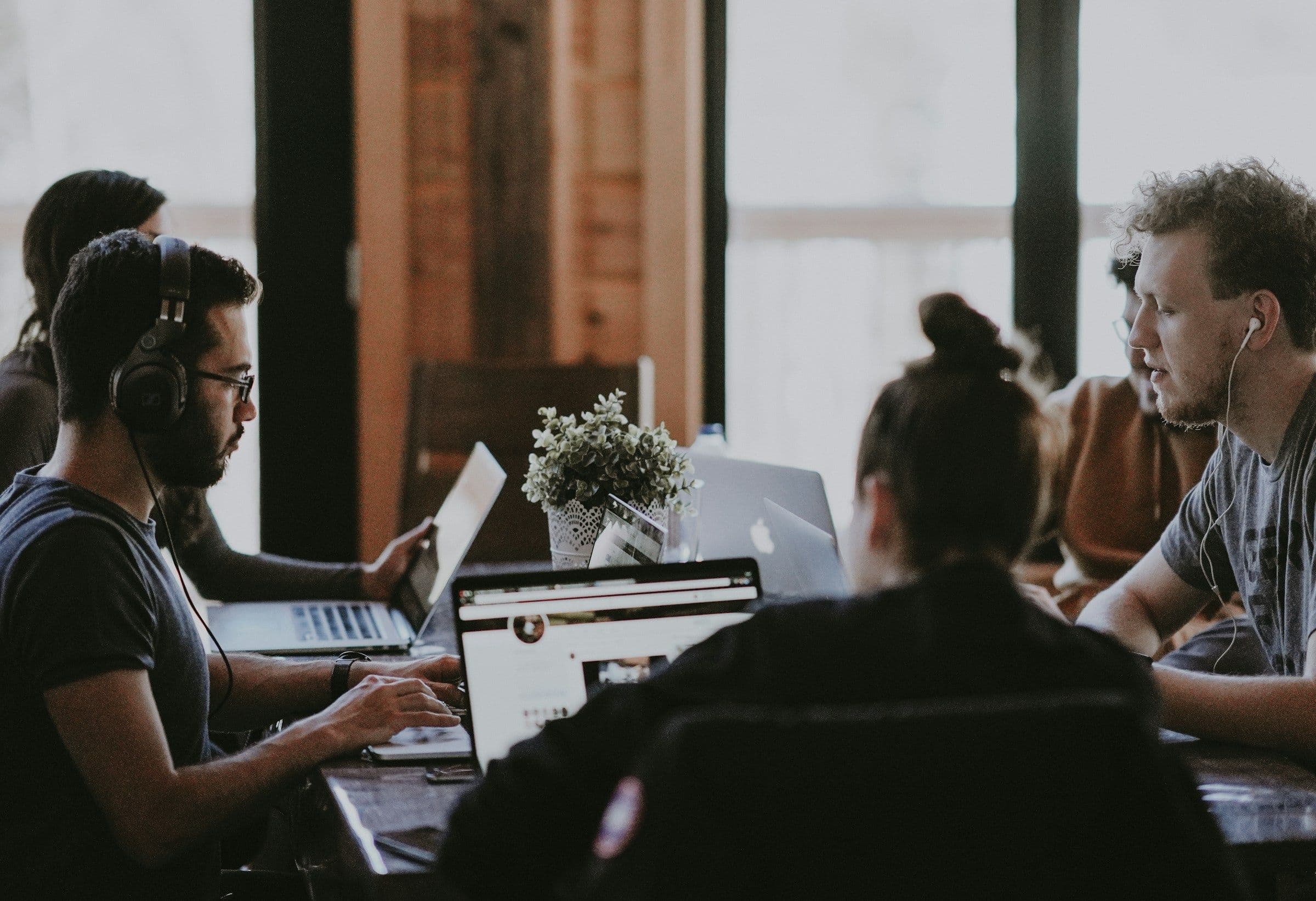 Engineers working together at a shared desk