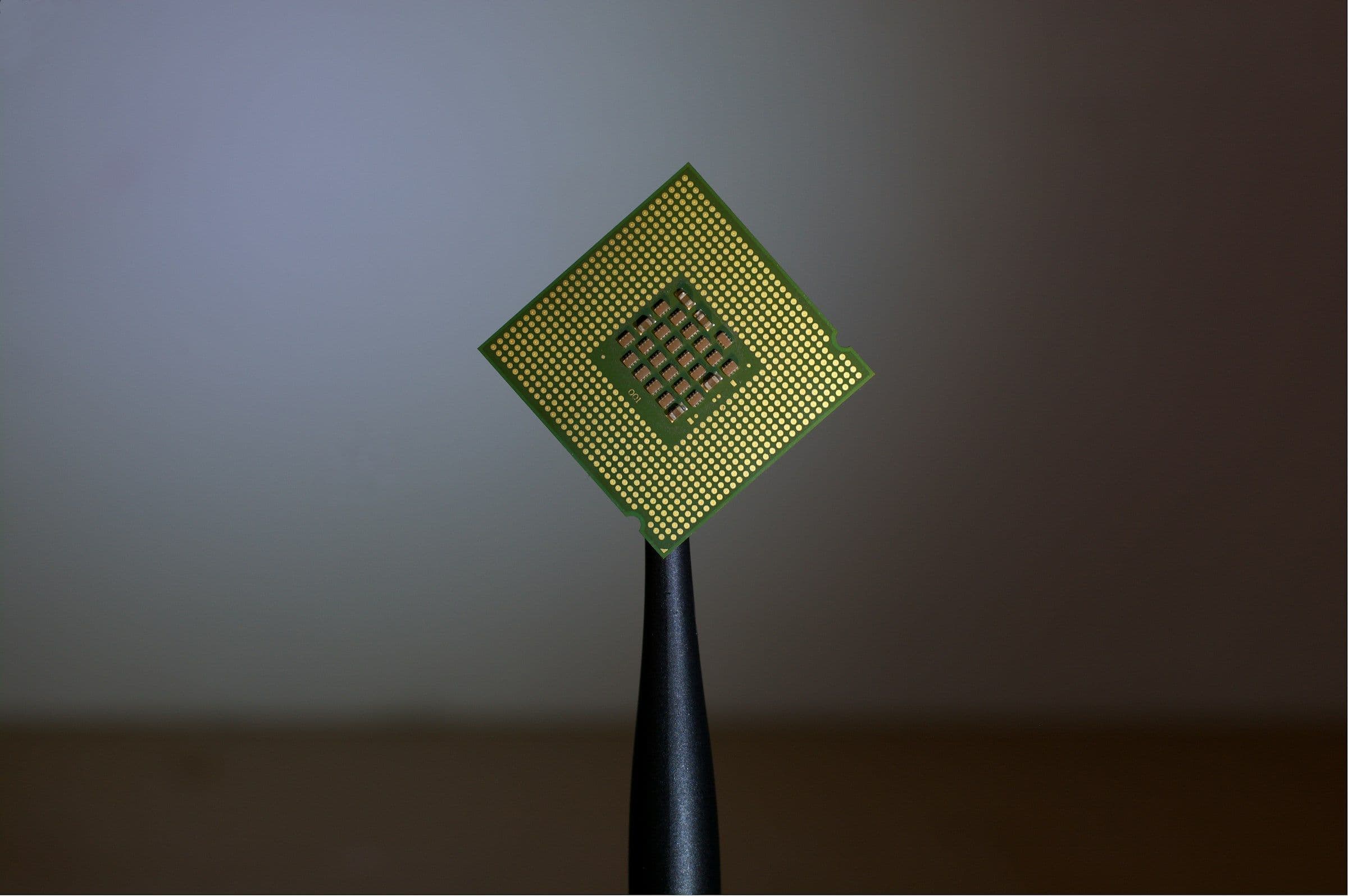 A processor held between fingertips
